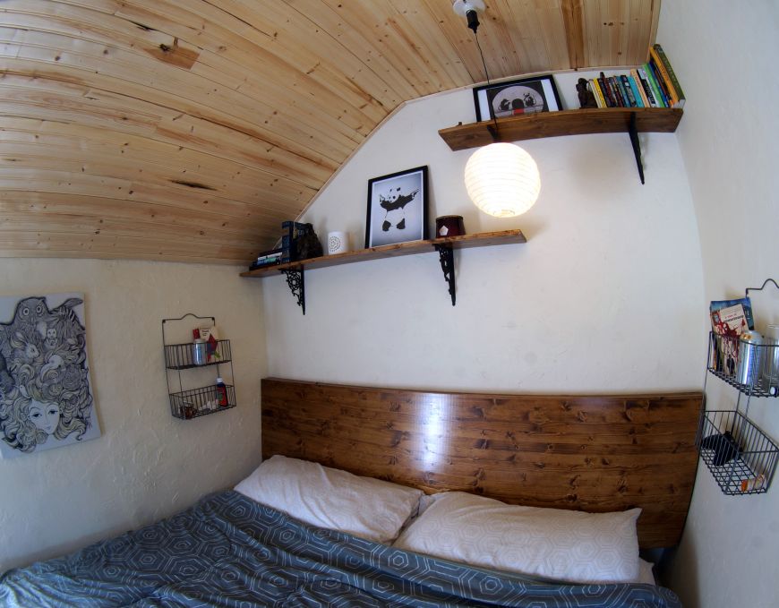 spruce pine headboard with shelves above bed